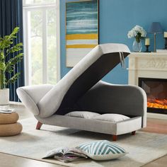 a living room with blue walls and white furniture