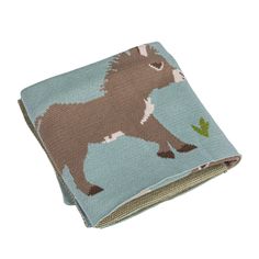 a small blanket with a donkey on it