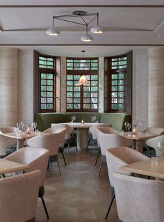 an empty restaurant with tables and chairs