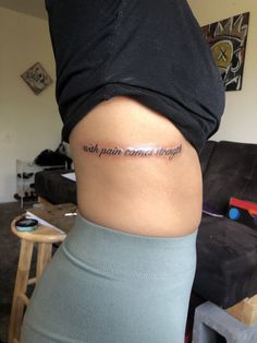 Quote About Strength Tattoo, Strength From Within Tattoo, Quotes About Strength Women Tattoo, Sayings For Back Tattoo, Women Strength Tattoo Ideas, Side Rip Tattoos Women, Self Strength Tattoo, Give Me Strength Tattoo, Fighter Tattoos For Women