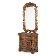 an ornate wooden vanity with mirror on top