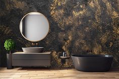 a black bath tub sitting next to a round mirror