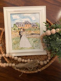 a watercolor painting of a bride and groom in front of a large house on a farm