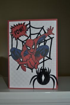 a spiderman card with the word pow on it