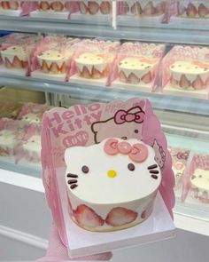 a hello kitty cupcake in a display case