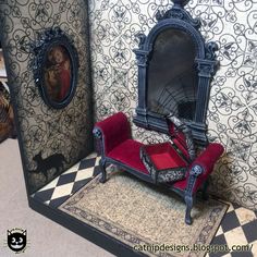 an elaborately decorated dollhouse with a red couch and mirror