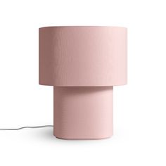 a pink lamp on a white background