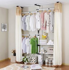 an open closet with clothes and other items on the shelves in front of it,