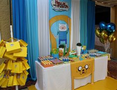 the table is set up for an adventure time birthday party