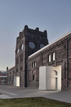 an old brick building with round windows