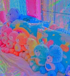 there are many stuffed animals on the bed with colorful lights in the room behind them