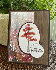 a close up of a card with a tree on it