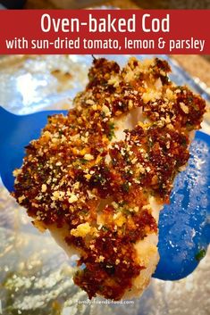 a close up of a piece of food on a plate with text overlay that reads oven baked god with sun - dried tomato, lemon and parsley