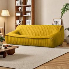 a living room filled with furniture and bookshelves