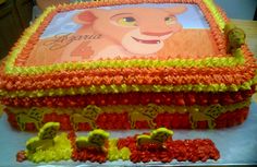 a birthday cake with an image of a lion on the front and lions on the back