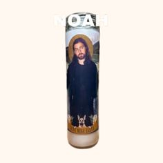 a candle with an image of jesus on it and the words noah written in white