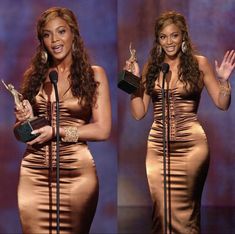 the two women are holding their awards in front of microphones and posing for pictures