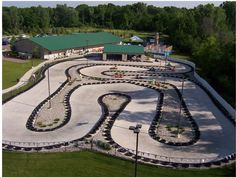 an aerial view of a park with many trees