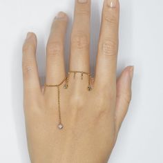 From our Elements collection, wear one or collect them all for the perfect stack! This ring is made with diamond cut bead chain, super shimmy fun with one round natural champagne diamond. Because it's a chain ring, we recommend to order a half size up. Details: -14k yellow gold -natural champagne round diamond -handmade in NYC Diamond Stackable Chain Ring For Promise, Stackable Diamond Toe Ring Jewelry, Diamond Stackable Toe Ring Jewelry, Adjustable Open Ring With Single Diamond, Dainty Diamond Toe Ring Jewelry, Fine Jewelry Open Ring With Adjustable Chain, Stackable Diamond Chain Ring, Diamond Chain Ring With Adjustable Chain As Gift, Promise Stackable Diamond Jewelry