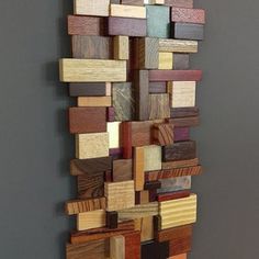 a wall sculpture made out of wood pieces