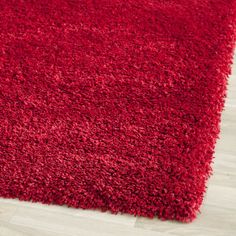 a red rug on the floor in a room