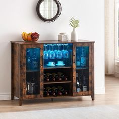 a wooden cabinet filled with bottles and glasses