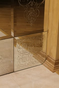 an image of a glass door with decorative designs on it