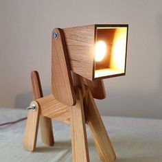 a wooden toy with a light on it