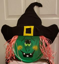 a close up of a paper plate with a witch's hat on it