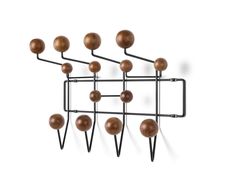 a metal rack with black balls hanging from it's sides and two hooks on each side