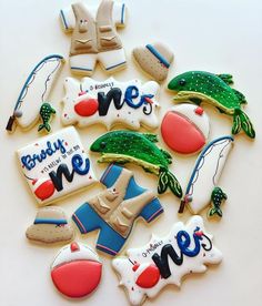 decorated cookies are arranged on a white surface