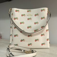 Coach Shoulder Or Crossbody Bag Depending On Which Strap You Use. It Is A Light Pink Color With Gold Hardware. The Detail Is Strawberry’s. The Bag Splits Into 3 Sections. I Have The Tag But I Lost The Little Booklet It Comes With. Only Worn A Few Times And Bought In 2022 . If You Have Any Questions Please Ask In The Comment Section And Please Do Not Ask Me To Leave This App And Email You. I Will Awnser In Comments. Thank You Coach Strawberry Bag, Coach Strawberry, Strawberry Bag, Light Pink Color, Pink Red, Coach Bags, Gold Hardware, Pink Color, Wallets