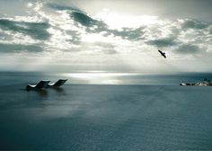 two boats floating in the ocean under a cloudy sky with birds flying over them and one boat on the water