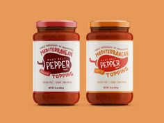 two jars of pepper sauce on an orange background with the label in red and white