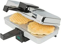 two waffles are being cooked on a toaster