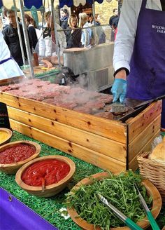 a person cooking food on top of a grill