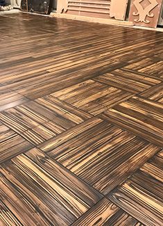 the floor is made out of wood planks and has been painted with metallic paint