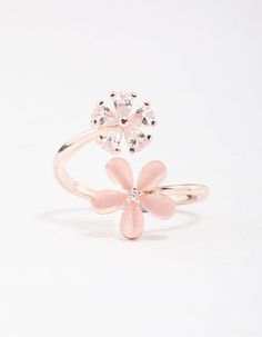 Warm up your stack with this gorgeous, rose gold cocktail ring. This ring features a spiral shaped silhouette, adorned with daisy motifs for a feminine finish. Dimensions: Diameter 18.5mm x Band Width 2mm | Lovisa Rose Gold Double Daisy Wrap Ring, Size: Medium/Large, Clear Rose Gold Ring For Spring, Spring Rose Gold Ring Jewelry, Rose Gold Jewelry For Anniversary In Spring, Rose Gold Jewelry For Spring Anniversary, Rose Gold Flower Shaped Jewelry For Spring, Rose Gold Flower-shaped Jewelry For Spring, Spring Rose Gold Flower Ring, Spring Wedding Rose Gold Flower Ring, Flower-shaped Promise Ring For Spring