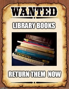 a pile of books sitting on top of a wooden table next to a sign that reads wanted library books return them now