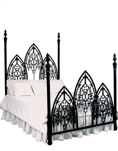 a black iron bed frame with white sheets and pillows on the bottom, in front of a white background