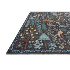 a rug with animals and trees on it