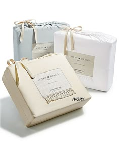 three different types of linen bags with tags on them