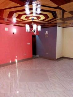 an empty room with red walls and ceiling