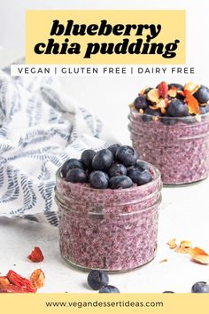 two jars filled with blueberry chia pudding on top of a white tablecloth