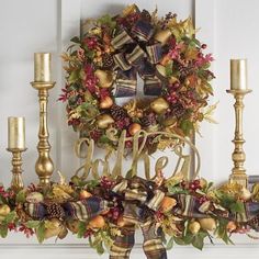 a decorated mantle with candles and wreath on it