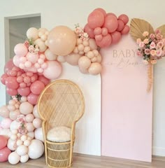 a chair and balloon wall in a room