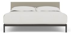 a bed with white sheets and two pillows on top of it, in front of a white background