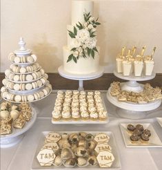 a table topped with lots of desserts and cakes