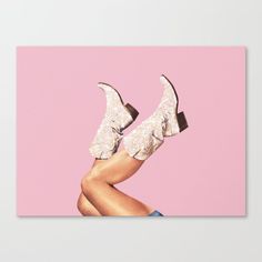 a woman's legs with high heels in front of a pink background metal print