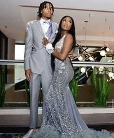 Grey Prom Dress Couple, Silver Suit For Men Prom, Silver Prom Outfits For Couples, Silver Prom Ideas Black Couples, Silver Prom Looks Black Couple, Silver Homecoming Couple, Silver Prom Dress With Date, Silver Prom Couple Outfit, Grey Suits For Prom